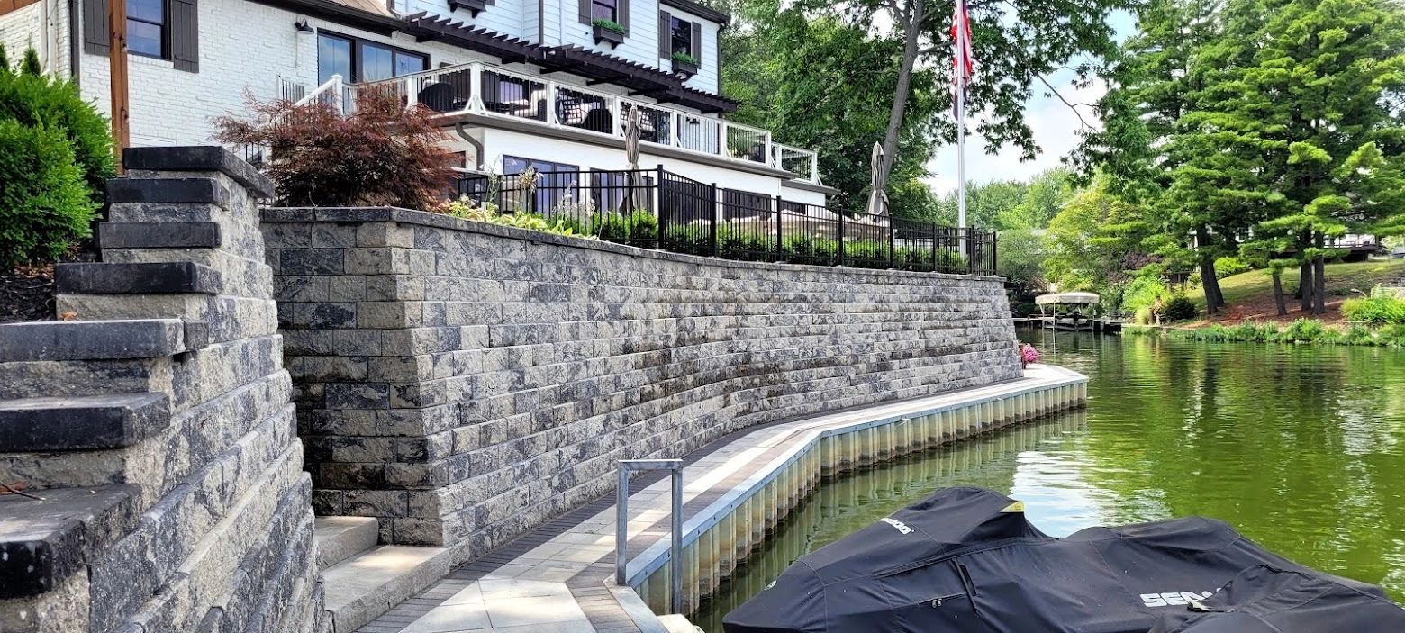 Stone shoreline retaining wall on the water